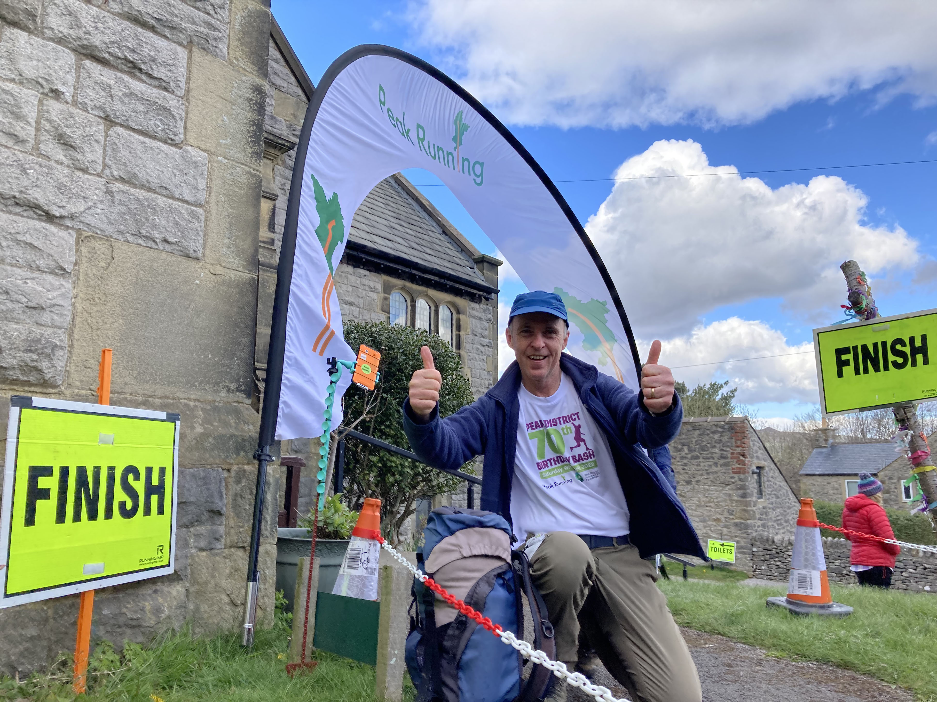 Foundation trustee Andrew McCloy celebrates completing the 35k hike with a double thumbs up